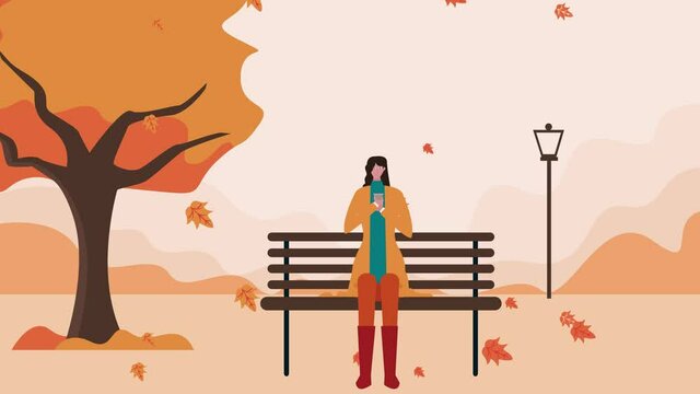 Woman warming herself with hot coffee at autumn