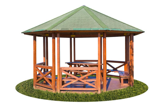 Wooden gazebos with picnic table and wooden bench in a garden - image on white background