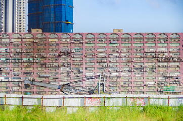 Residential area in old apartment with windows. High-rise building, skyscraper with windows of...