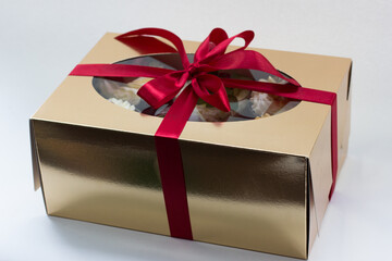 raspberry chocolate cake with whipped cream in a gift box