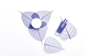 Cosmetic products on white background top view. SPA natural organic beauty products. Blue color filter