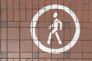 road sign pedestrian on the sidewalk.