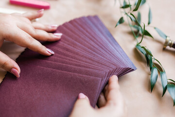 pink mother-of-pearl envelopes on a background of velvet paper