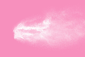 White powder explosion on pink background. Paint Holi.