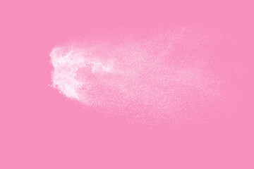 Obraz premium White powder explosion on pink background. Paint Holi.