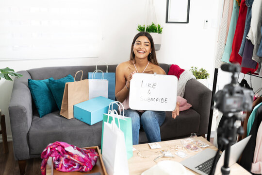 Influencer showing a call to action in video - Powered by Adobe