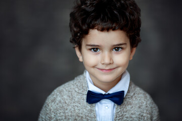 close-up portrait of boy with bow tie