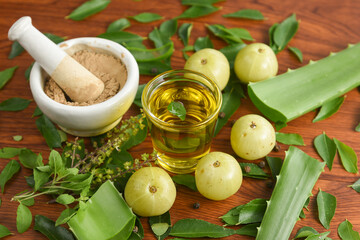 Ayurvedic Oil or Herbal Hair Oil with Herbs tulsi,  curry leaves, oil, amla berry , amla powder ,...