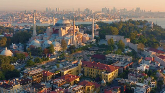Istanbul, Hagia Sophia Grand Mosque (Ayasofya) with a Golden Horn on the background at sunset. Aerial view