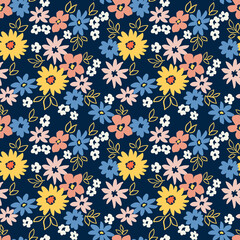 Vintage floral background. Seamless vector pattern for design and fashion prints. Flowers pattern with small colorful flowers on a dark blue background. Ditsy style.