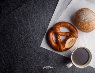 Homemade breads or bun, croissant and bakery ingredients on black slate background, breakfast food concept top view and copy space.top view
