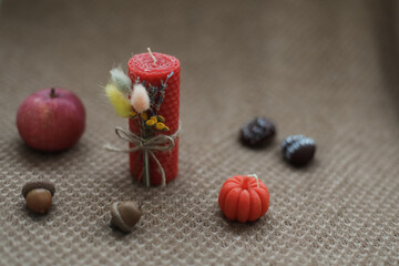 Autumn home decor with candles. Cozy fall composition. Happy thanksgiving concept.  Hygge home decor. autumn holiday card design