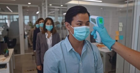 Temperature check for covid of business people in office - Powered by Adobe