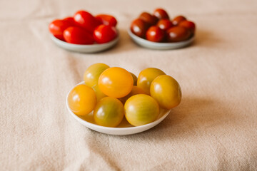 Different kind of organic tomatoes in a bowl. 