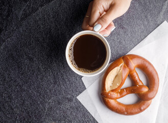 Homemade breads or bun, croissant  bakery ingredients and a cup of coffee on black slate background, breakfast food concept top view and copy space.top view