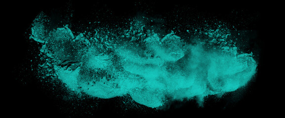 explosion of teal powder and smoke