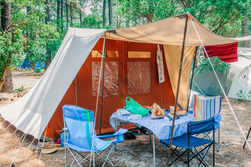 Large tent on campground in forest