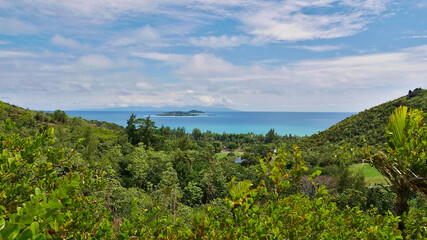 Panoramic view over the north of Praslin island, Seychelles with tropical rainforest and the two...
