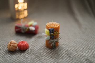 Autumn home decor with candles. Cozy fall composition. Happy thanksgiving concept.  Hygge home decor. autumn holiday card design