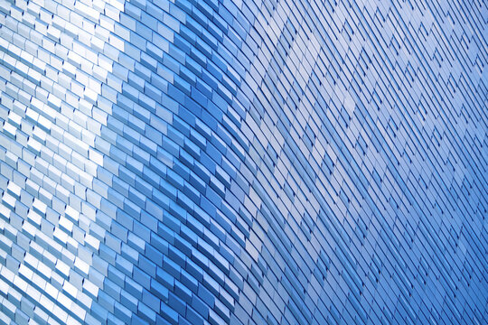 modern metal and glass modern background or wall of architecture design with blue light. abstract structure of spaceship wall interior and exterior or modern building.