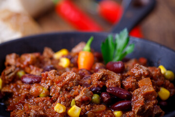 chili con carne on wood
