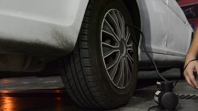 someone inflate the car tyres