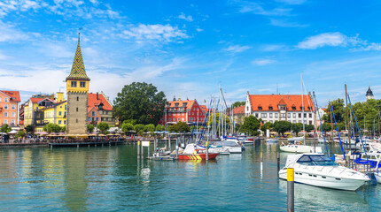 Lindau town in Bavaria, Germany. Panorama of harbor at Lake Constance (Bodensee) in summer. - obrazy, fototapety, plakaty