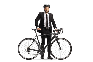 Obraz premium Businessman with a helmet standing next to his bicycle