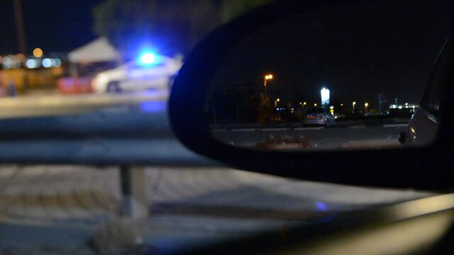 low light soft focus. views from the car to the police checkpoint quarantine coronavirus at night. 