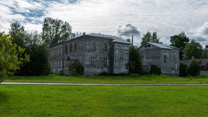 Old wooden house on a lawn in Petrozavodsk, Karelia, Russia, August 2020