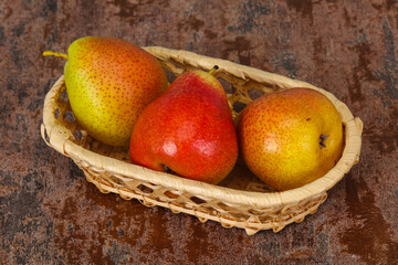Pear heap in the wooden basket