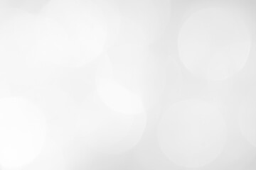 A brilliant white background with circles and ovals. Template for a holiday card with bright and sparkling lights.