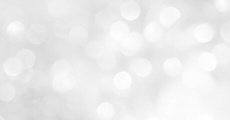 A brilliant white background with circles and ovals. Template for a holiday card with bright and sparkling lights.