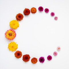 Round frame from autumn flowers.