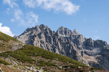 Fototapeta na wymiar Avusor rocky mountains peak against blue sky