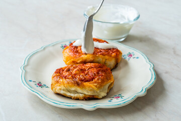 Turkish Traditional Food Borek Manti with Minced Meat, Tomato Paste and Yogurt / Yoghurt Burek Dumplings Sosyete Mantisi.
