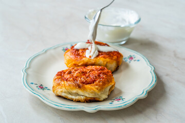 Turkish Traditional Food Borek Manti with Minced Meat, Tomato Paste and Yogurt / Yoghurt Burek Dumplings Sosyete Mantisi.