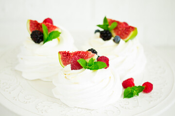 Pavlova's meringue dessert with berries and fruits