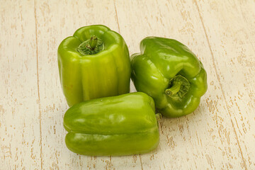 Three green bell juicy peppers