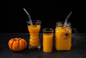 Pumpkin mocktails in different glasses with straws