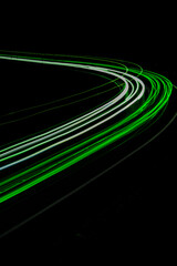 green car lights at night. long exposure