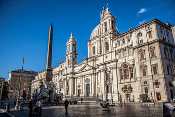 Fototapeta premium Navona square, St. Agnes Church and the fountain of the Four rivers in Rome on a Sunny may morning. Rome, Lazio, Italy