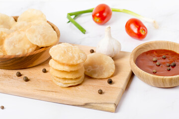 Indian dish luchi on a white table