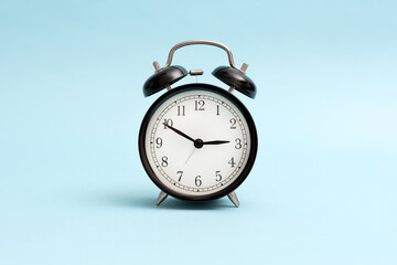Analog clock on blue background