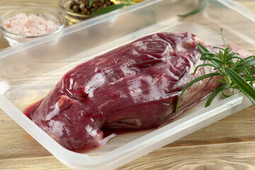 raw skirt-steak vacuum with rosemary and spices