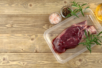 raw skirt-steak vacuum with rosemary and spices