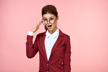 Business woman red jacket glasses executive lifestyle studio pink background