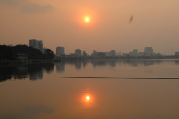 Fototapeta premium Epic sunset over the skyline of Hanoi