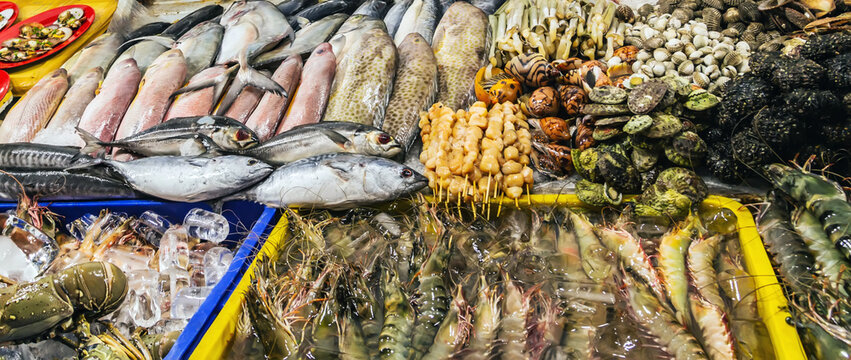 Grilled Meatballs fresh tuna fish display on ice sea food market.