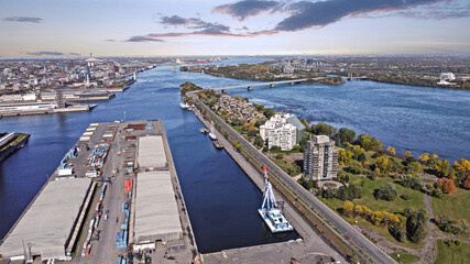 Fototapeta na wymiar Aerial view on Montreal St-Lawrence river, Jacques Cartier Bridge, Habita 67, Biosphère and Casino de MOntreal